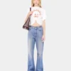Flared jeans embellished with 1969 discs