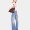 Flared jeans embellished with 1969 discs