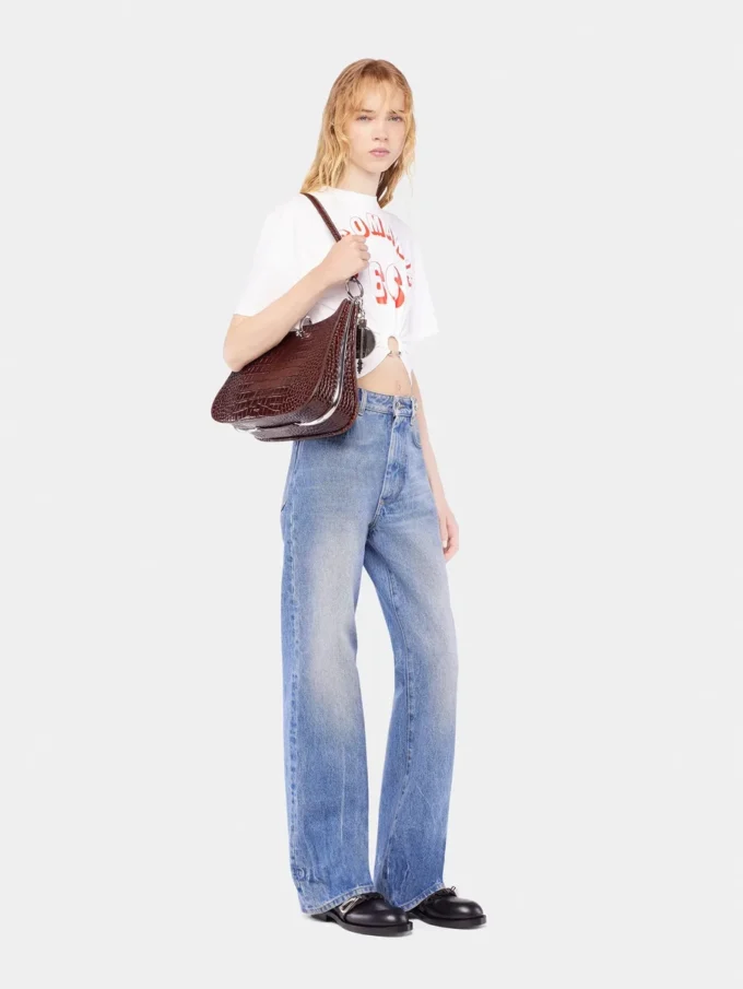 Flared jeans embellished with 1969 discs