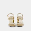Gold sandals with Sparkle disc heels