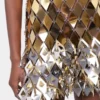 Gold short dress in assembly