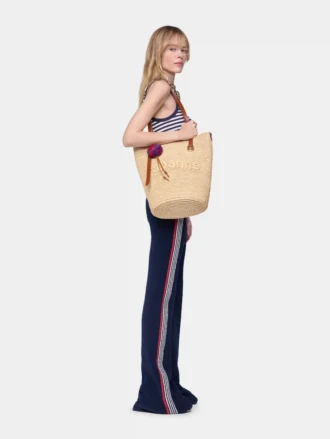 Natural raffia tote bag with charms Natural raffia tote bag with charms